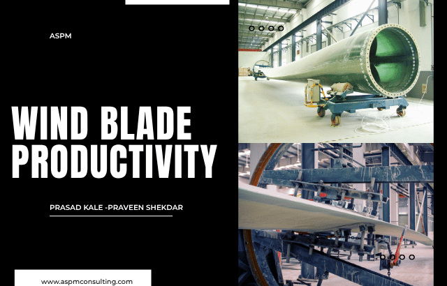 Wind turbine blade being manufactured inside a large industrial factory